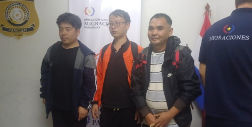 The three deported Chinese nationals pictured before leaving the country. Source: PDS Radio Y TV Digital